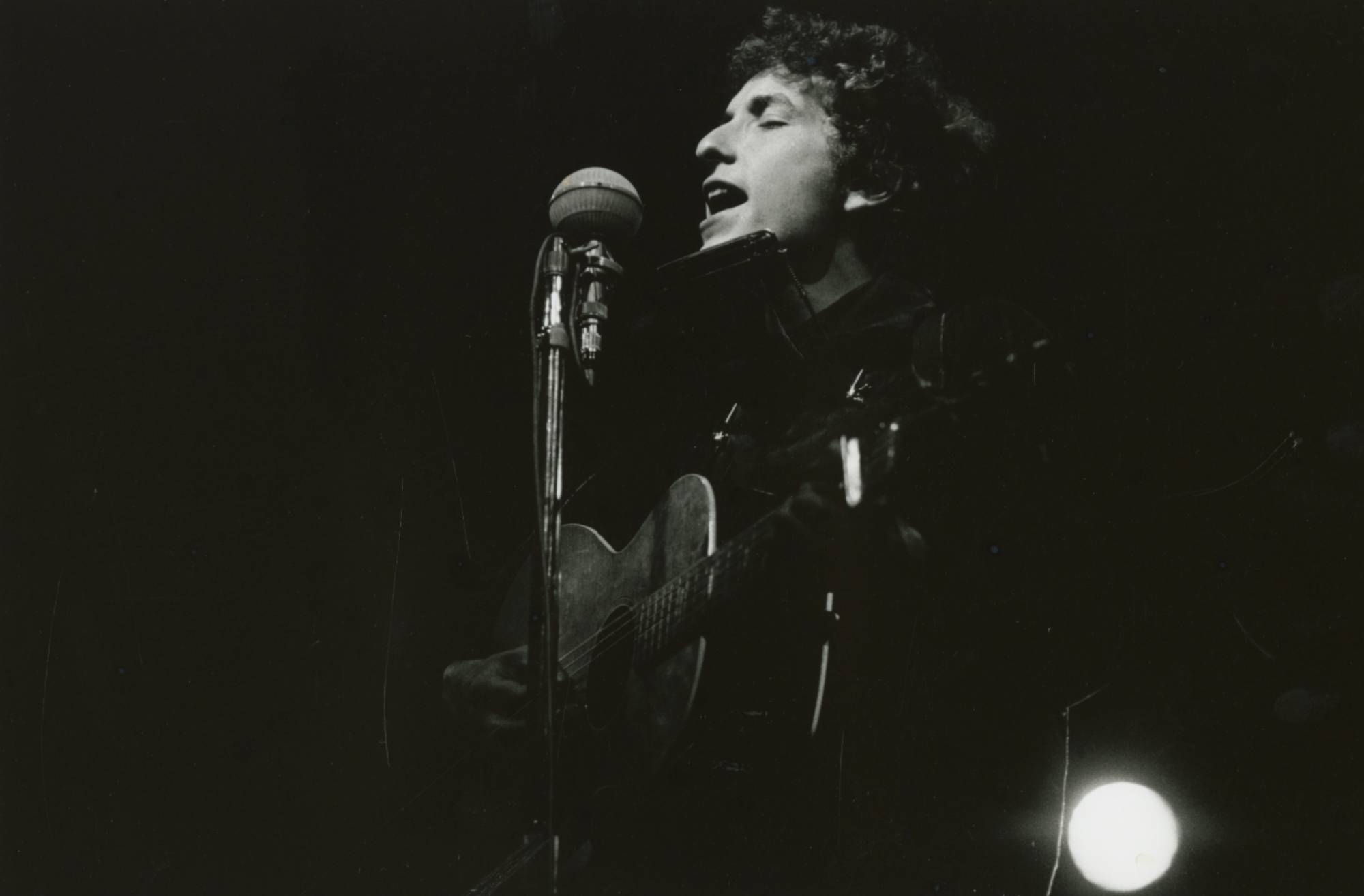 Bob Dylan performing at the Newport Folk Festival